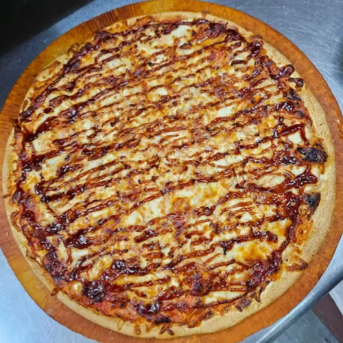 Buffalo Chicken Pizza - Tender chicken tossed in spicy buffalo sauce on our hand-stretched dough with melted cheese.