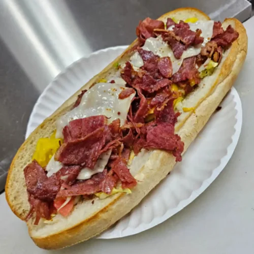Steak & Cheese Sub - Loaded with steak, provolone, grilled onions, mushrooms, and your choice of toppings — absolutely delicious!